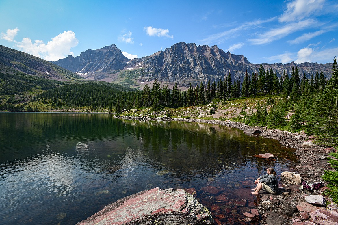 Soaking in the views of Mount Rockwell and Sinopah Mountain from Cobalt Lake on the Two Medicine Pass Trail in Glacier National Park on Sunday, Aug. 11. (Casey Kreider/Daily Inter Lake)