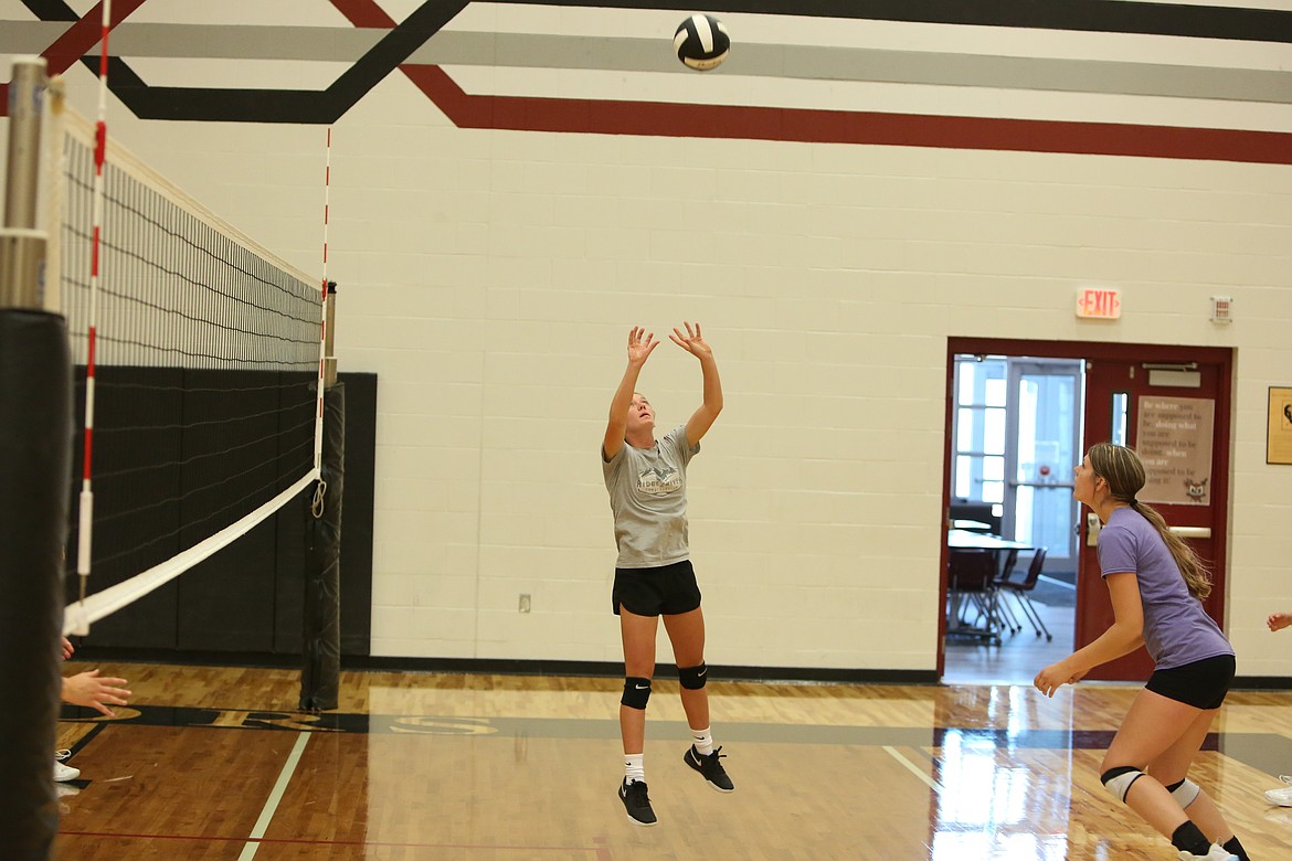 Almira/Coulee-Hartline junior Naomi Molitor, in grey, sets the ball to junior Emma Brummett, in purple, during a practice ahead of the 2024 season.