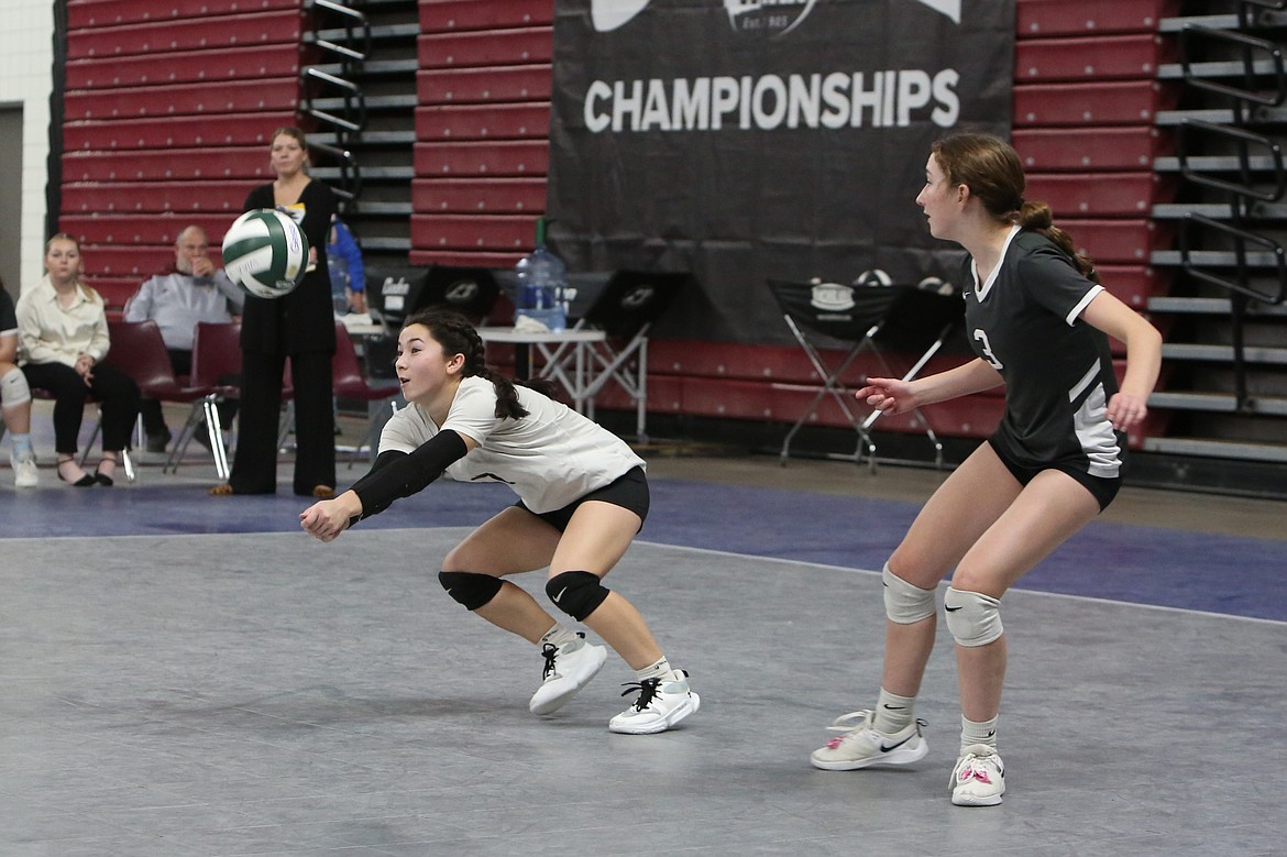 Almira/Coulee-Hartline sophomore Grace Okamoto, in white, prepares to receive a serve against Mossyrock in the 1B State Volleyball Tournament last year. Okamoto is the lone Warrior returning with all-league recognition last fall.