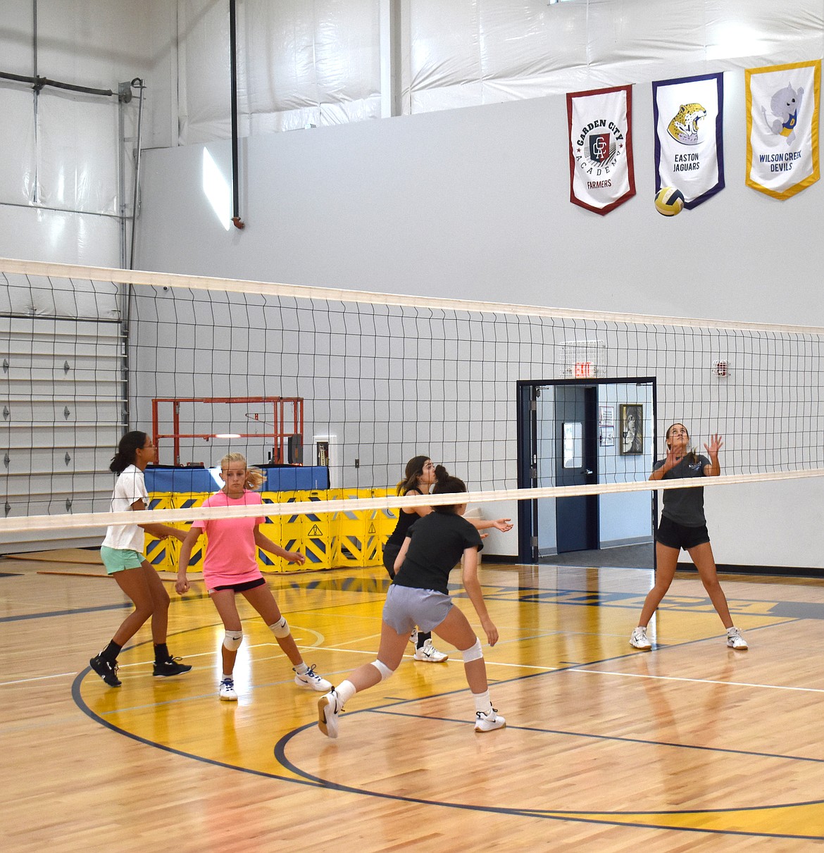 From left: SanTahna Ferguson, Rebecca Wiser, Kayla Piper, Brooklyn Dorsing and Sasha Veresko keep moving as the ball crosses the net at Moses Lake Christian Academy/Covenant Christian School volleyball practice Aug. 30. Head Coach Dean Spurbeck said aggressive movement is a focus of this year’s training.