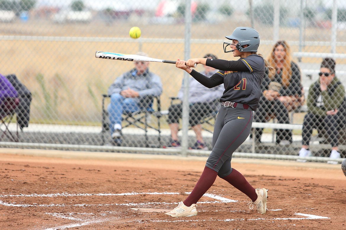 Moses Lake junior Addisyn Reffett (21) makes contact with a pitch during a game against Hermiston in the 2023 season.