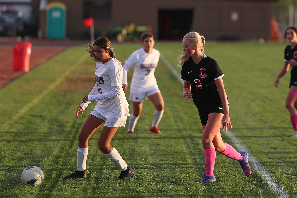 Othello senior Launa Mollotte (2) looks to take the ball away from a Grandview defender during a game last fall.