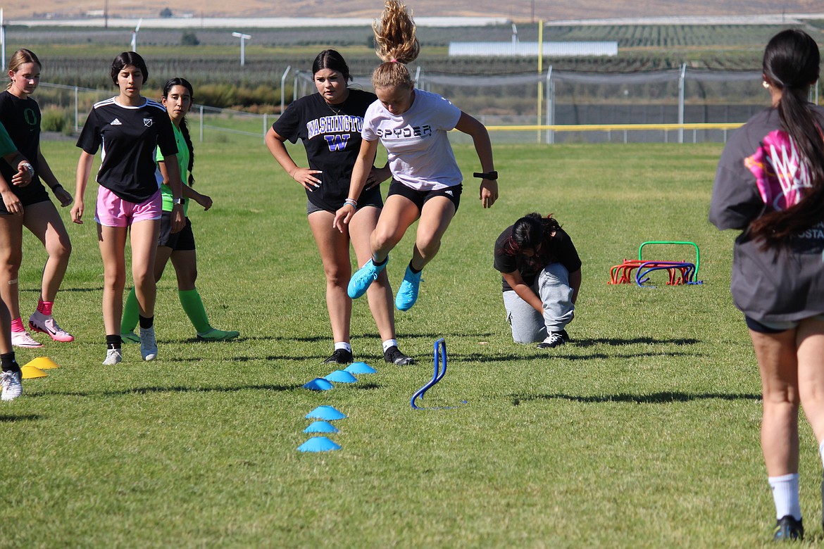 Quincy girls soccer players work through agility drills at an early-season practice. The Jacks move up to the 2A Central Washington Athletic Conference for the 2023-24 season.