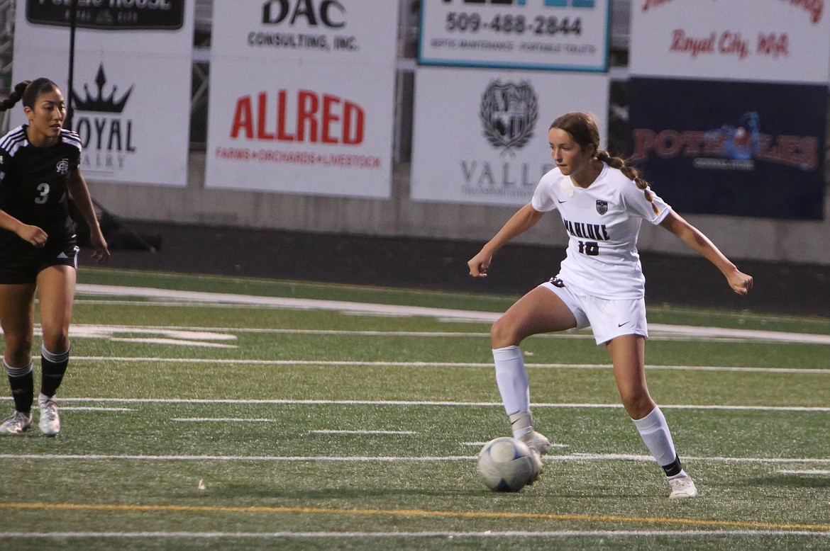 Wahluke sophomore Morgan Harlow, in white, controls the ball during a road game against Royal last year.