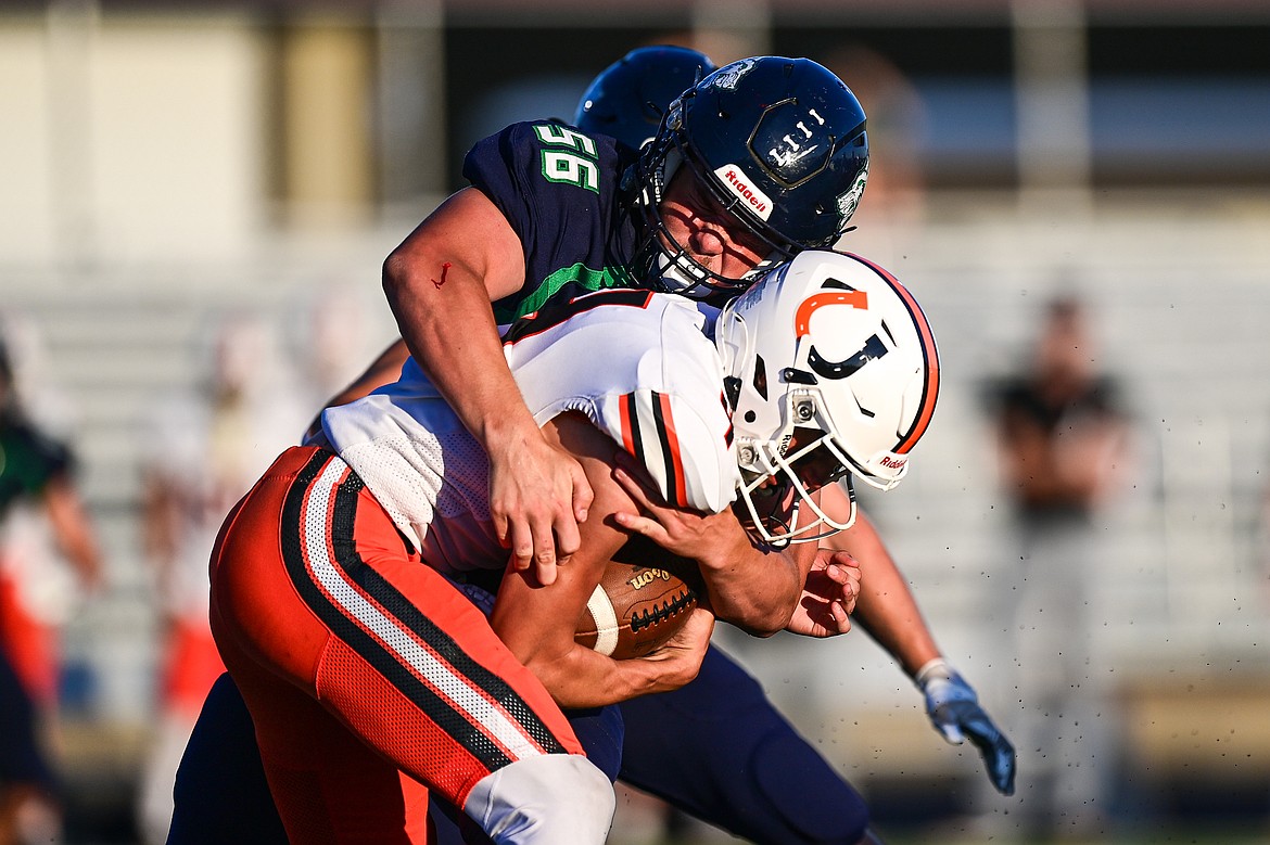 Glacier defensive lineman William Astle (56) sacks Billings Senior quarterback Ryder Murdock in the first quarter at Legends Stadium on Friday, Sept. 6. (Casey Kreider/Daily Inter Lake)