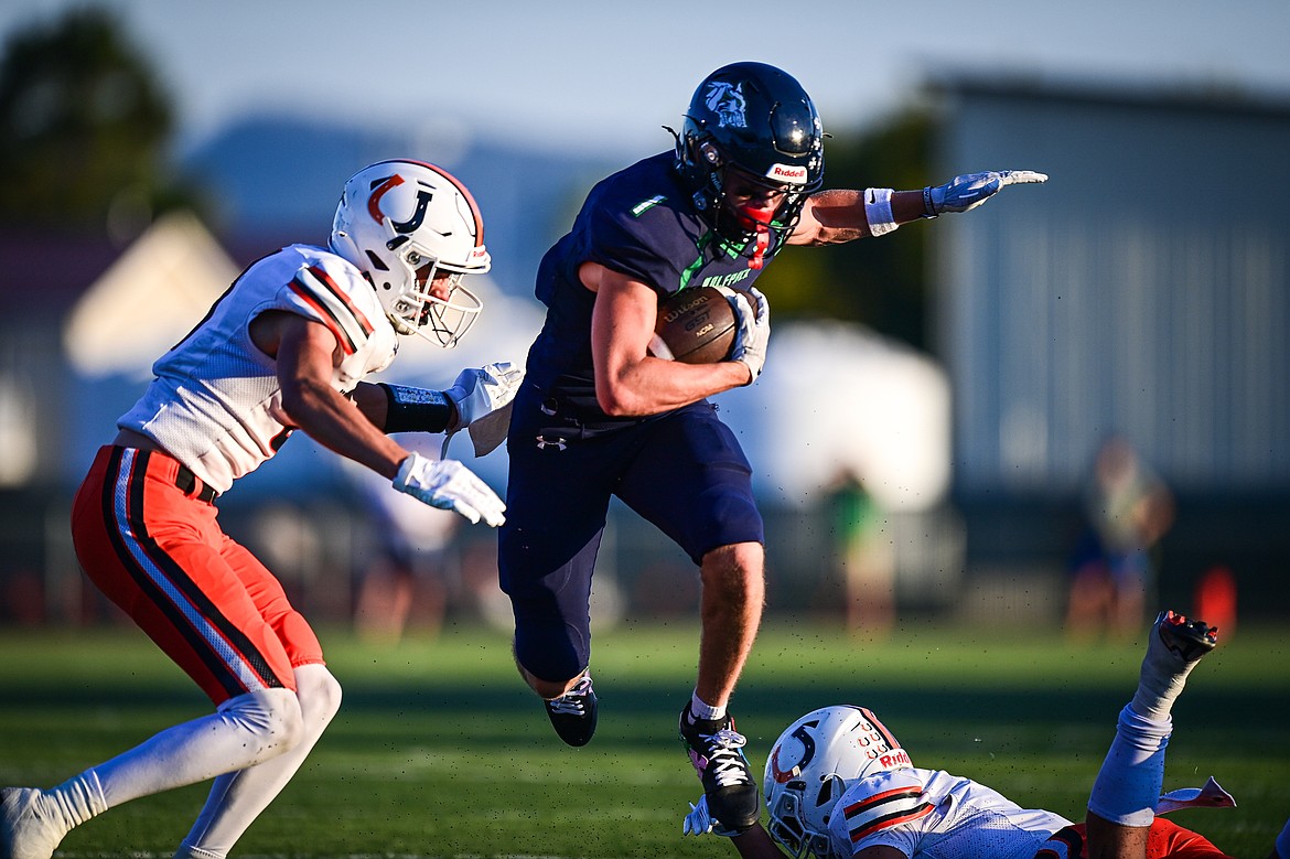 Glacier wide receiver Bridger Smith (1) picks up yardage after a reception in the first quarter against Billings Senior at Legends Stadium on Friday, Sept. 6. (Casey Kreider/Daily Inter Lake)