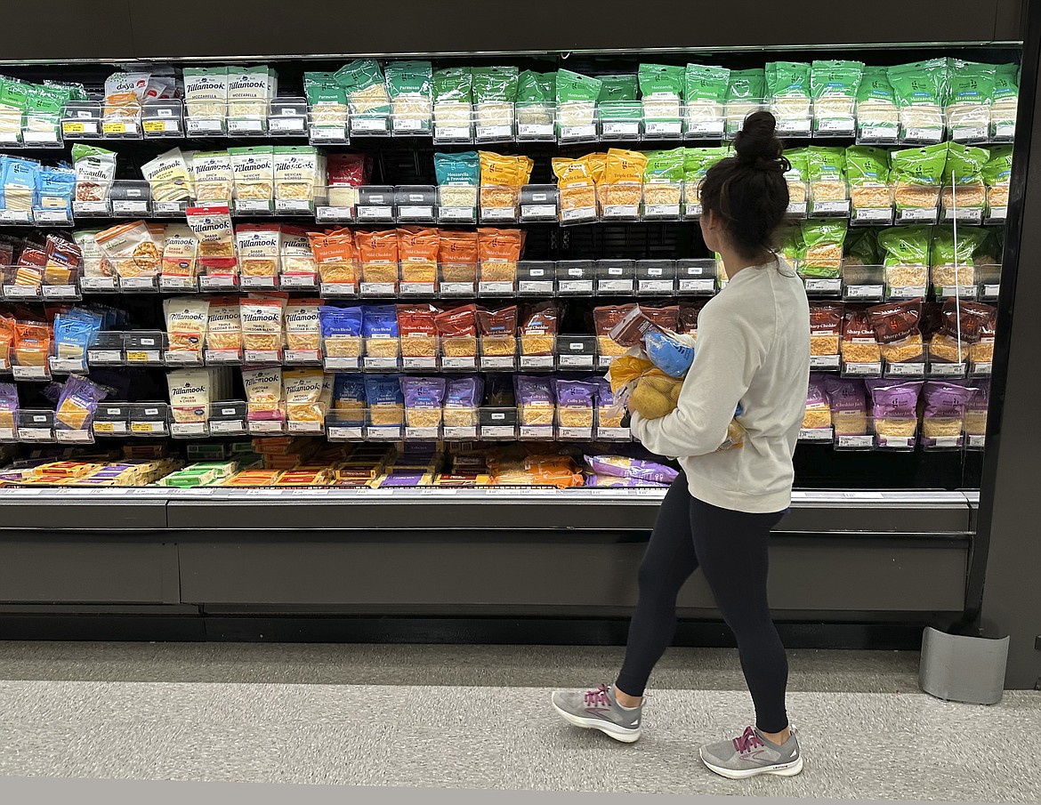 A shopper peruses cheese offerings at a Target store on Oct. 4, 2023, in Sheridan, Colo. (AP Photo/David Zalubowski, File)