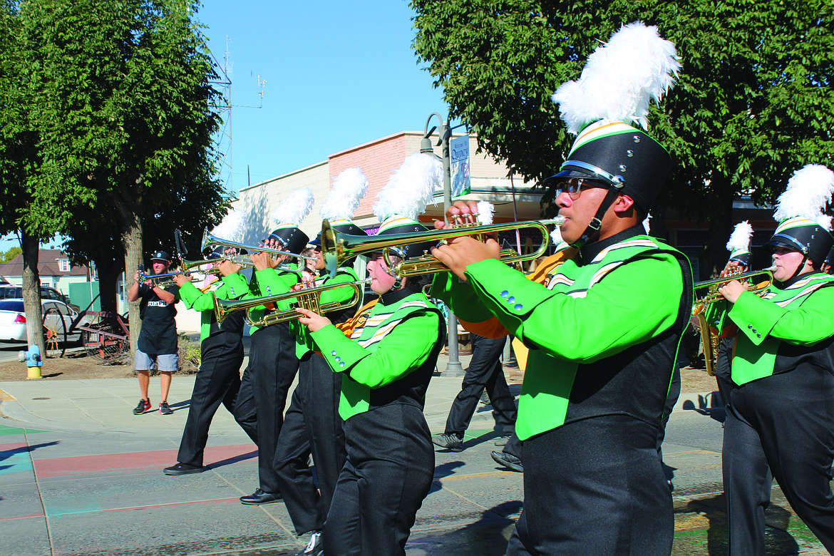 Quincy High School band members show off their new uniforms in the 2023 FCAD parade.