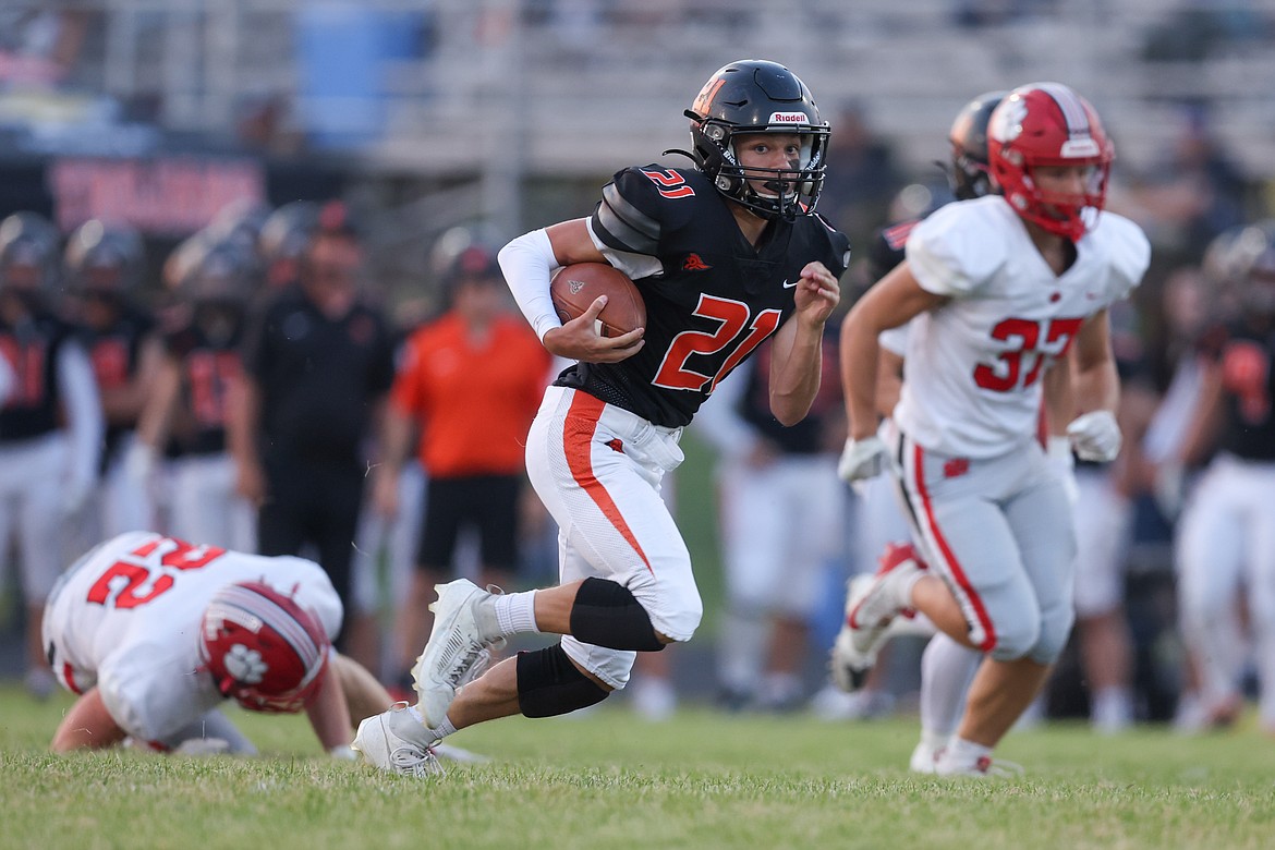 JASON DUCHOW PHOTOGRAPHY
Post Falls junior Brandon Felix (21) rushed for 108 yards against Sandpoint on Friday night at Trojan Stadium, and the Trojans totaled 221 yards on the ground.