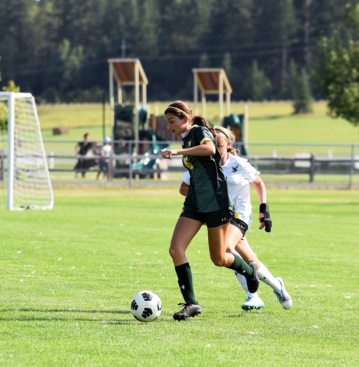 Freshman Grace Sliman dribbles away from her mark at the Stevensville game last week at home. (Julie Engler/Whitefish Pilot)