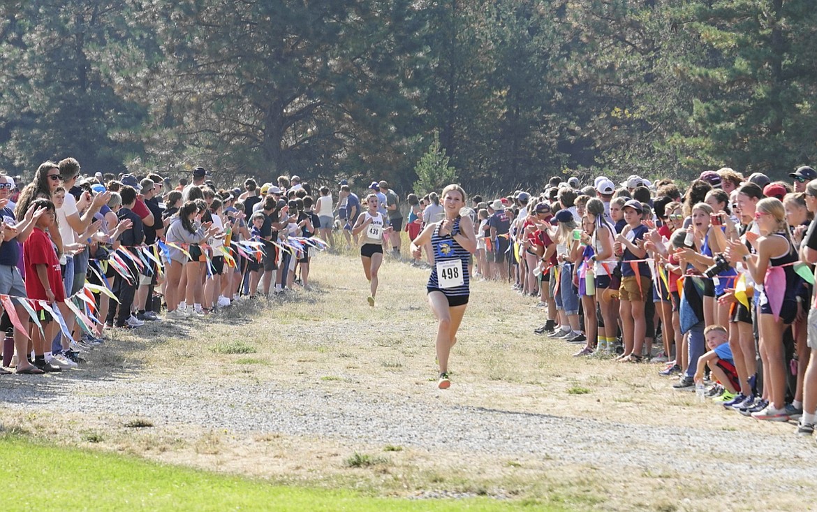 Photo by GEORGE ROHLINGER
Coeur d'Alene junior Dakota Keyworth races toward the finish line in the girls race at the Timberlake Farragut Invitational on Saturday. Keyworth finished third out of 126 competitors.