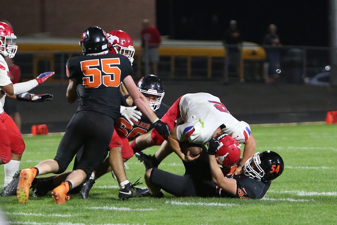 Ephrata sophomore Owen Fitch (54) and senior Coleman Cobb (60) combine for a sack against Prosser in the fourth quarter of Friday’s 15-14 win over the Mustangs.