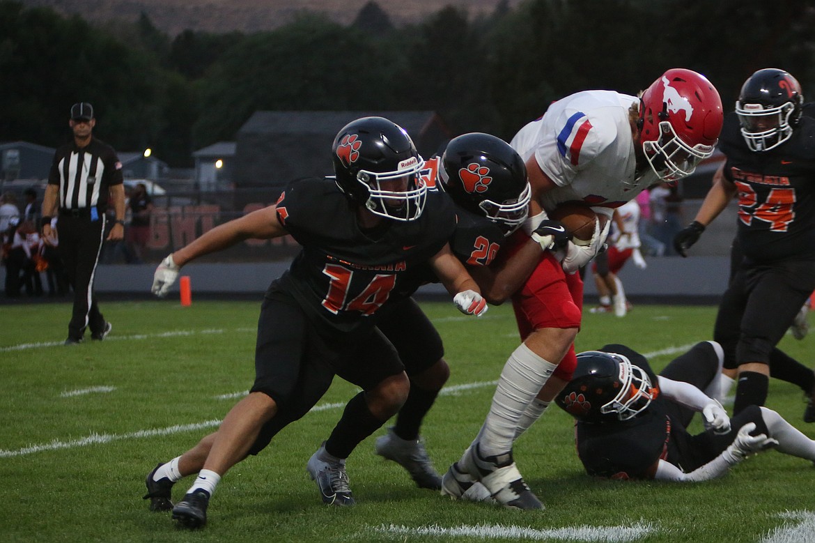 Ephrata defenders rallied for a tackle against Prosser in the second quarter of Friday’s game.