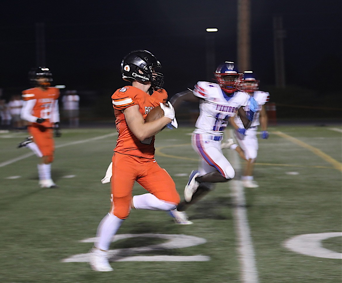 Chief Laurance Lozeau brings the ball down the field for a Ronan touchdown in last Friday's game against Bigfork. (Susan Lake photo)