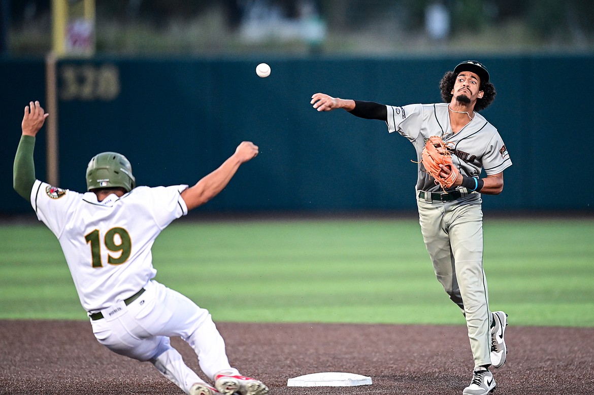 Missoula shortstop Kamron Gillman (2) turns a double play in the second inning against Glacier at Glacier Bank Park on Tuesday, Sept. 10. (Casey Kreider/Daily Inter Lake)