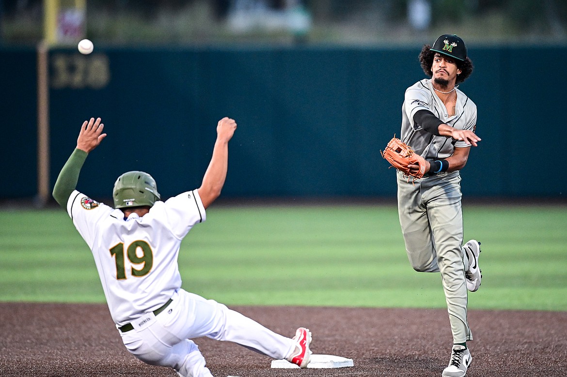 Missoula shortstop Kamron Gillman (2) turns a double play in the second inning against Glacier at Glacier Bank Park on Tuesday, Sept. 10. (Casey Kreider/Daily Inter Lake)