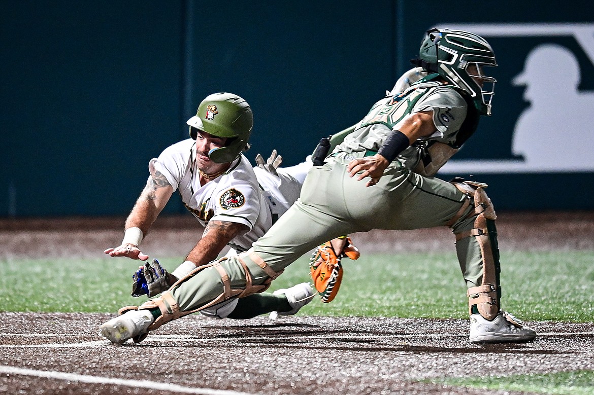 Glacier's Gabe Howell (10) scores from first base on a double by Chad Castillo (28) in the sixth inning against Missoula at Glacier Bank Park on Tuesday, Sept. 10. (Casey Kreider/Daily Inter Lake)