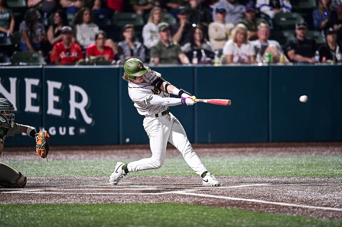 Glacier's Kingston Liniak (20) connects on a double in the fifth inning against Missoula at Glacier Bank Park on Tuesday, Sept. 10. (Casey Kreider/Daily Inter Lake)