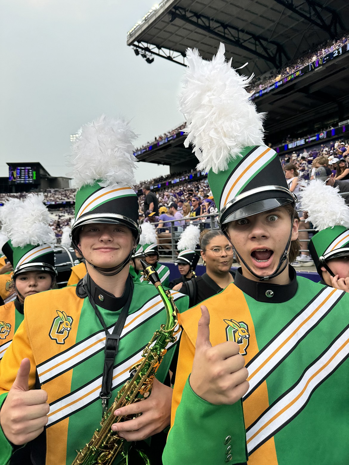 Quincy High School band members Keegan Nelson, left, and Owen Yeates show their enthusiasm at Husky Band Day in Seattle Saturday.