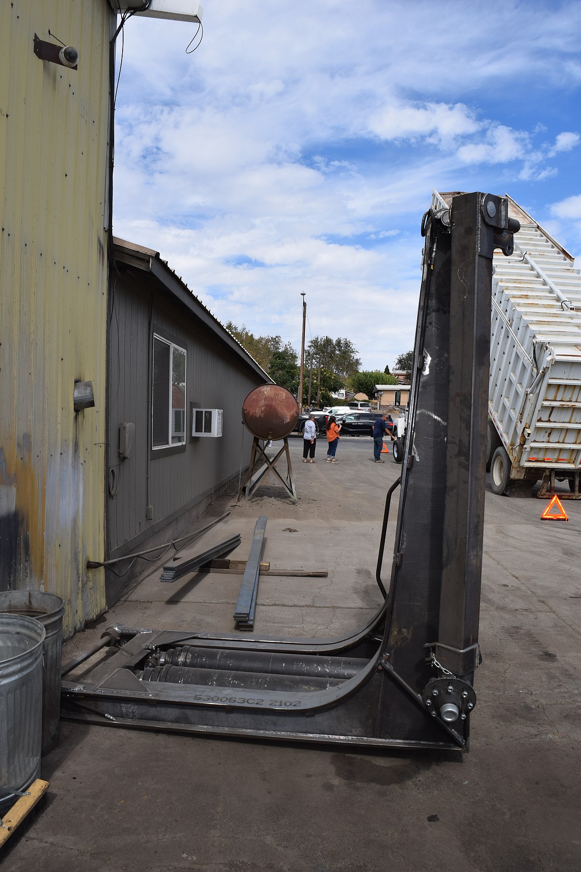 A Callahan hoist outside the factory door ready for installation onto a cargo rig. The system is operated using hydraulics.