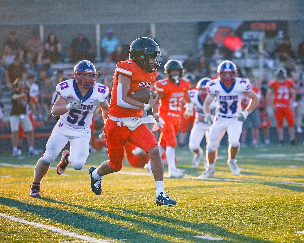 Chief Kolby Finley runs the ball during last Friday's game against Bigfork. (Christa Umphrey photo)