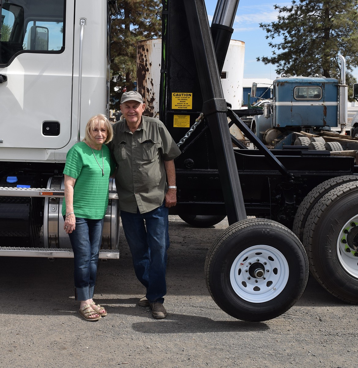 Nancy and Dean Callahan stop for a photo in front of a rig that has just been upgraded with a Callahan Manufacturing Hoist system. The couple was married in 1965 and have operated the Royal City business for 55 years now.