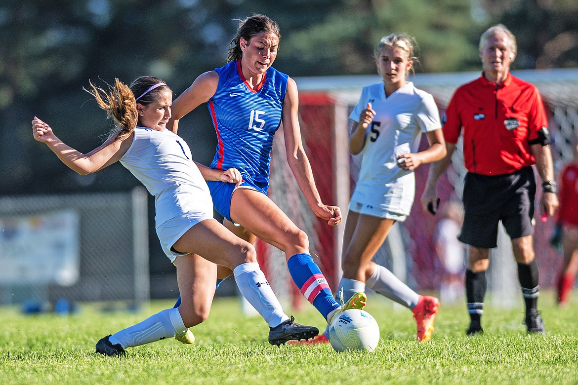 Braeden Gunlock pushed towards the goal playing Libby on Thursday. (Avery Howe/Bigfork Eagle)