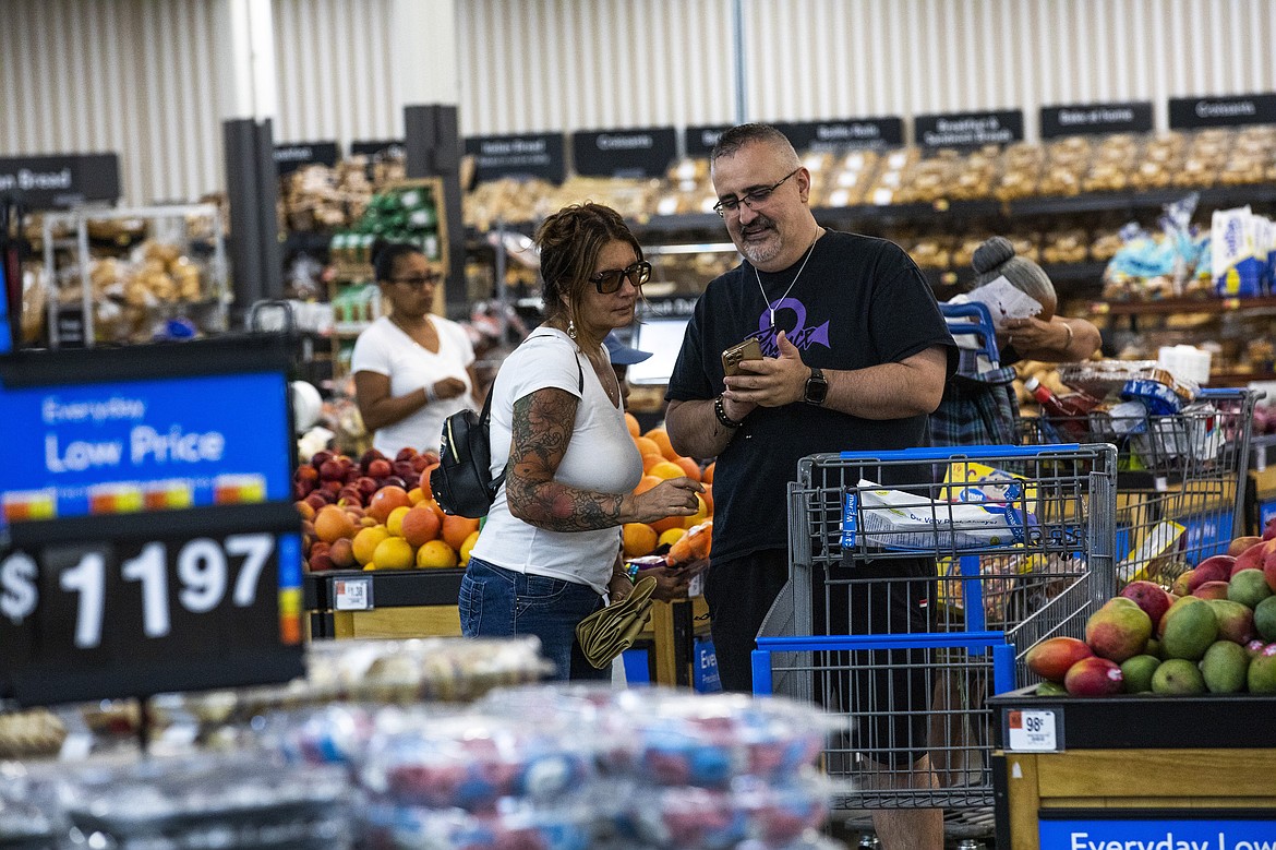 Shoppers pause in the produce section at a Walmart Superstore in Secaucus, New Jersey, July 11, 2024. (AP Photo/Eduardo Munoz Alvarez, File)