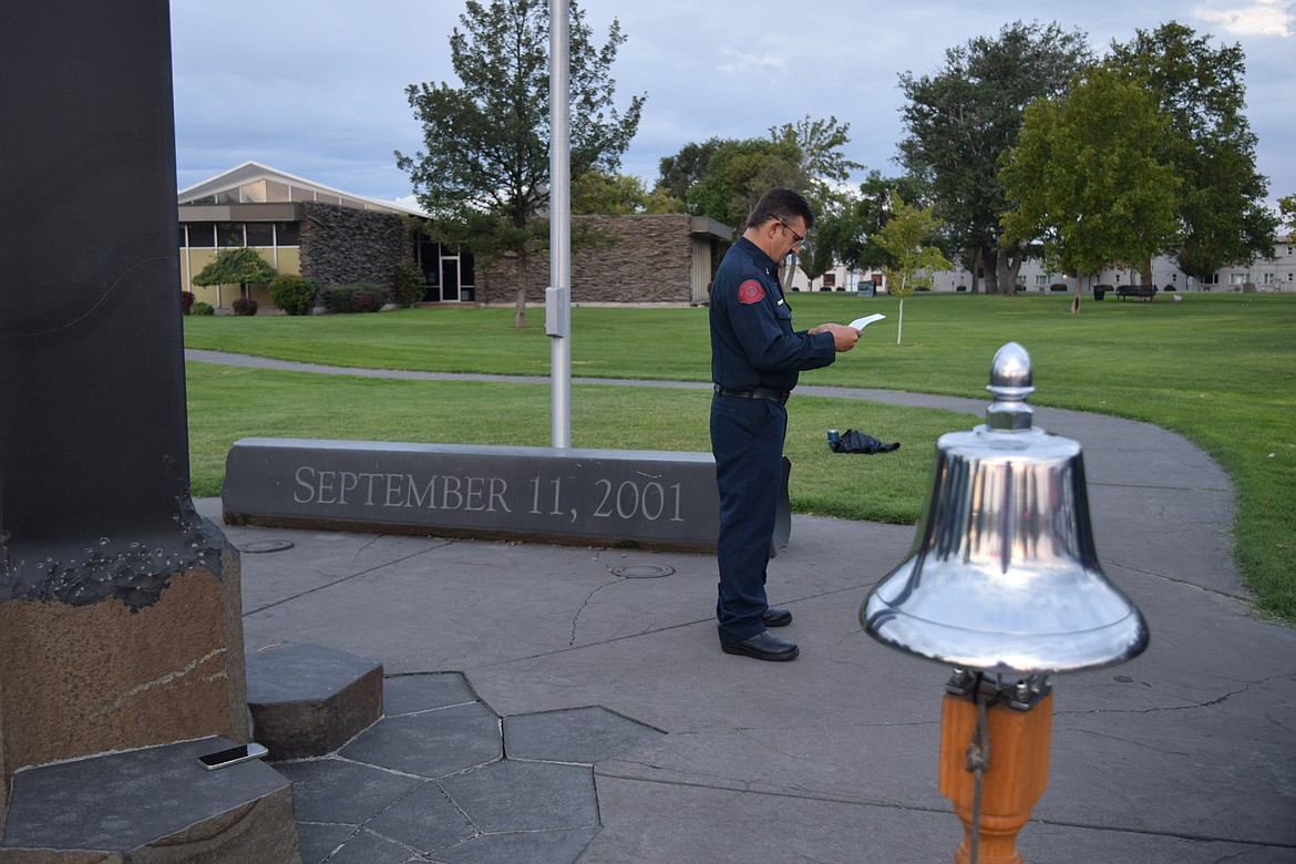 Moses Lake Fire Department Lieutenant Jason Koziol reads a speech to remember the firefighters, police officers and civilians that were lost on Sept. 11, 2001.