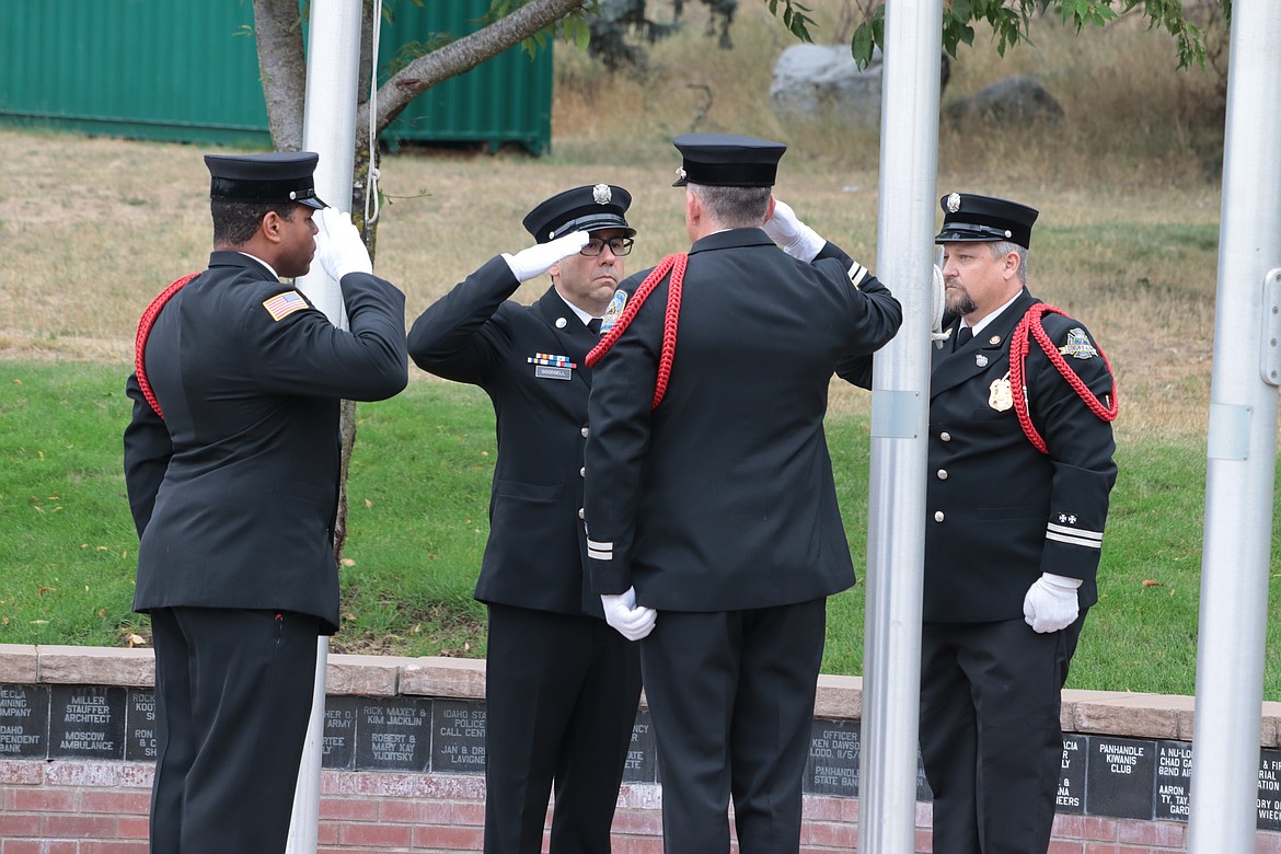 The Coeur d'Alene Fire Department honor guard leads the 9/11 memorial ceremony at Fallen Heroes Plaza on Wednesday. The honor guard includes Josh Hoston, Craig Etherton, Matt Tosi and Andrew Goodsell.