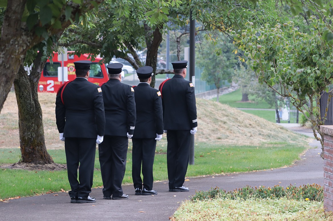 The Coeur d'Alene Fire Department honor guard leaves the 9/11 memorial ceremony at Fallen Heroes Plaza on Wednesday.