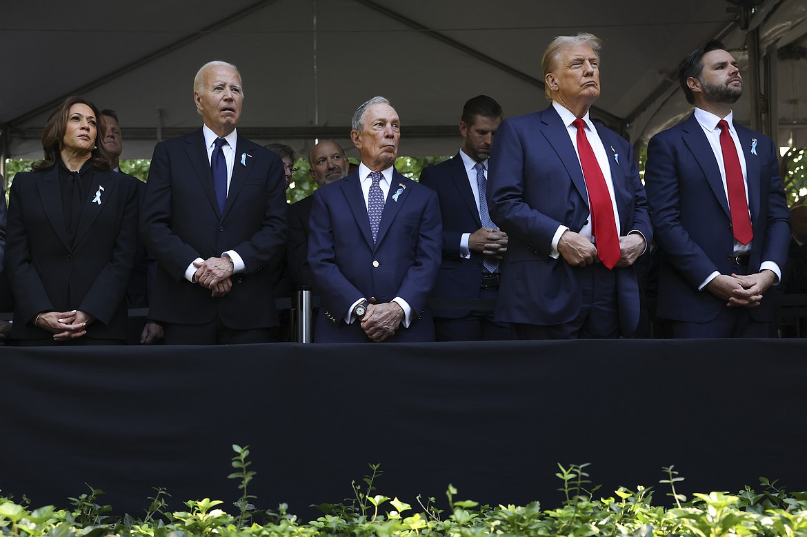 From left, Democratic presidential nominee Vice President Kamala Harris, President Joe Biden, Michael Bloomberg, Republican presidential nominee former President Donald Trump and Republican vice presidential nominee Sen. JD Vance, R-Ohio, attend the 9/11 Memorial ceremony on the 23rd anniversary of the Sept. 11, 2001 attacks, Wednesday, Sept. 11, 2024, in New York. (AP Photo/Yuki Iwamura)