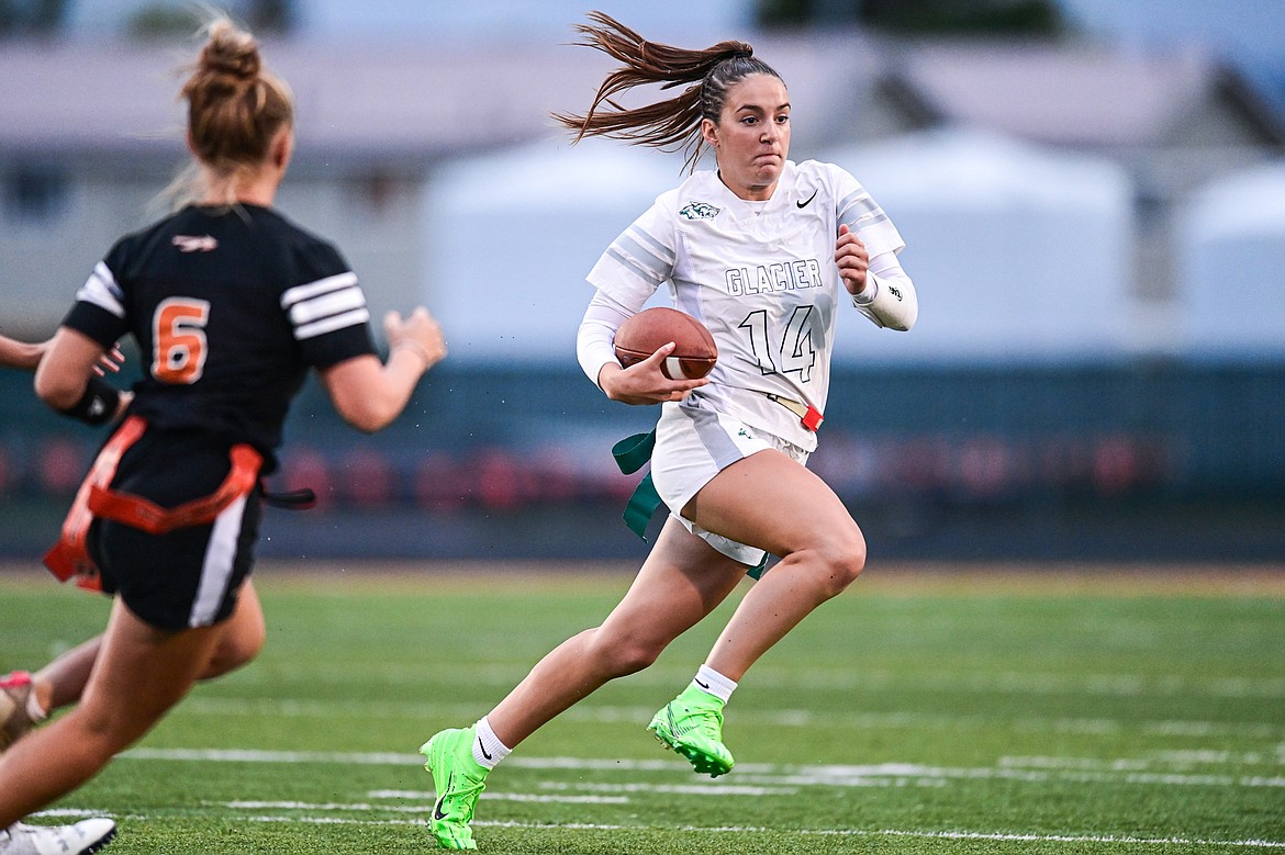 Glacier quarterback Karley Allen (14) takes off running against Flathead at Legends Stadium on Thursday, Sept. 12. (Casey Kreider/Daily Inter Lake)