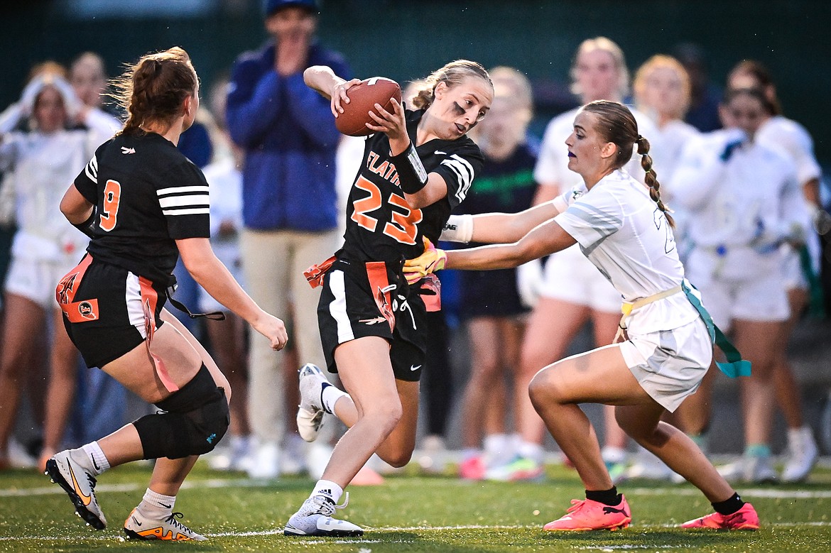 Flathead's Julia Kay (23) picks up yardage after a reception against Glacier at Legends Stadium on Thursday, Sept. 12. (Casey Kreider/Daily Inter Lake)