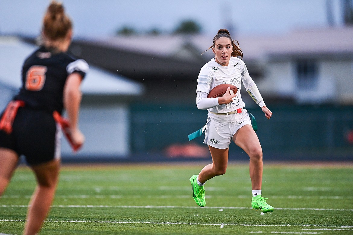 Glacier quarterback Karley Allen (14) takes off running against Flathead at Legends Stadium on Thursday, Sept. 12. (Casey Kreider/Daily Inter Lake)