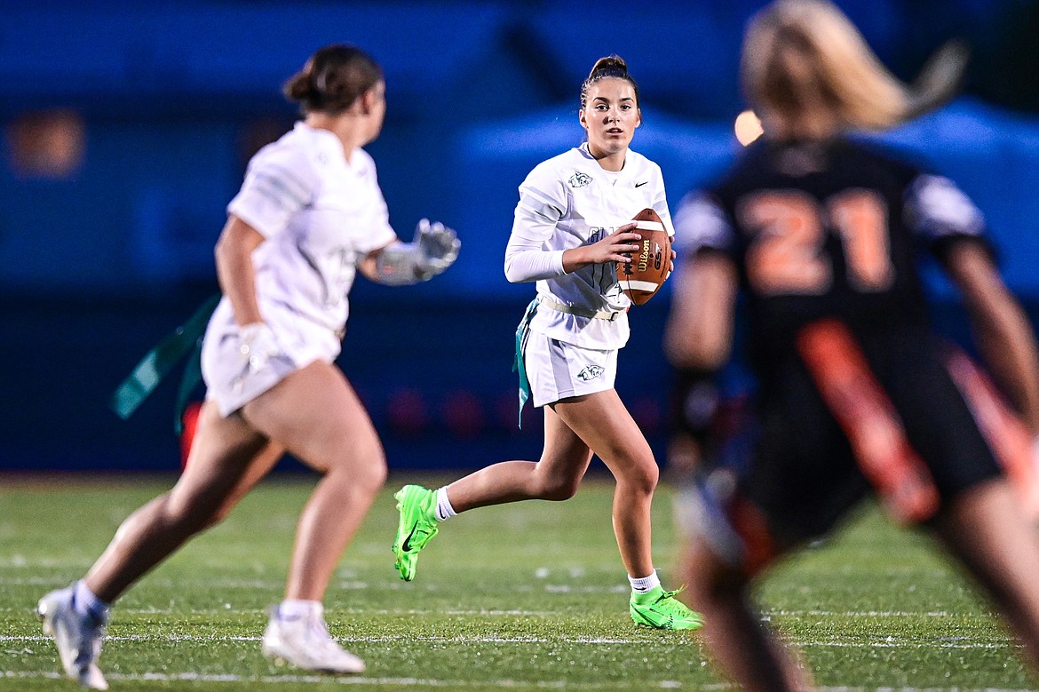 Glacier quarterback Karley Allen (14) rolls out to pass against Flathead at Legends Stadium on Thursday, Sept. 12. (Casey Kreider/Daily Inter Lake)