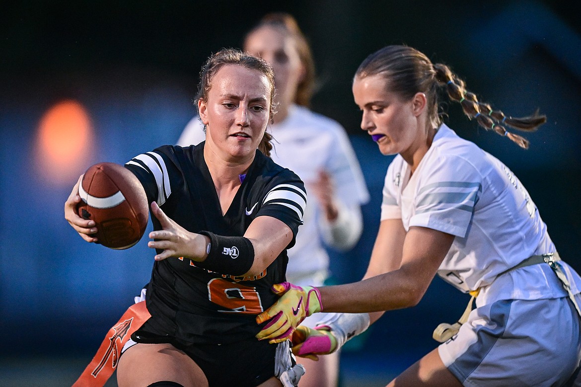 Flathead's Kylie Anderson (9) picks up yardage on a reception against Glacier at Legends Stadium on Thursday, Sept. 12. (Casey Kreider/Daily Inter Lake)