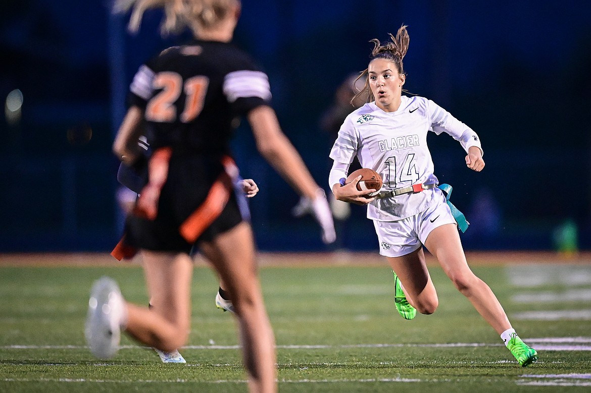 Glacier quarterback Karley Allen (14) takes off running against Flathead at Legends Stadium on Thursday, Sept. 12. (Casey Kreider/Daily Inter Lake)