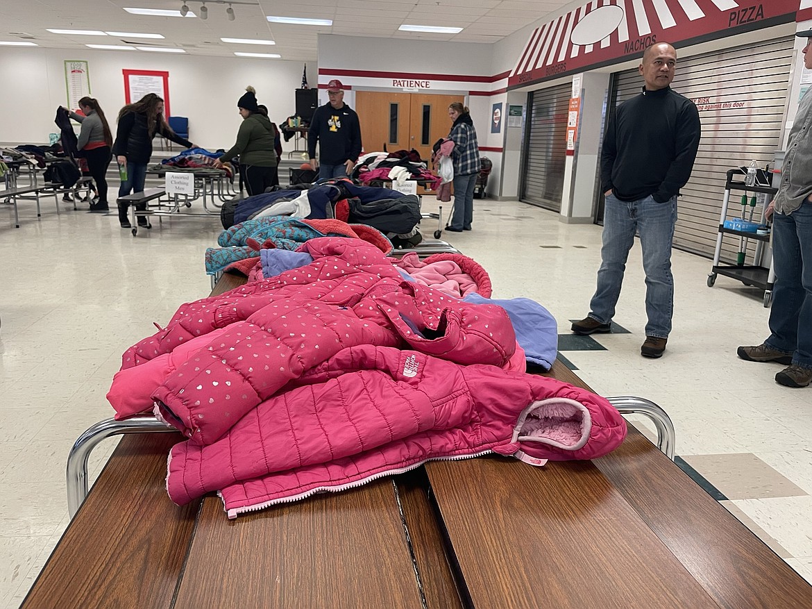 Alex Town, one of the organizers of the 2022 Coats 4 Kids drive organized by the Rotary Club of Moses Lake, watches over a table of coats waiting to be distributed. This year’s drive begins Oct. 5.