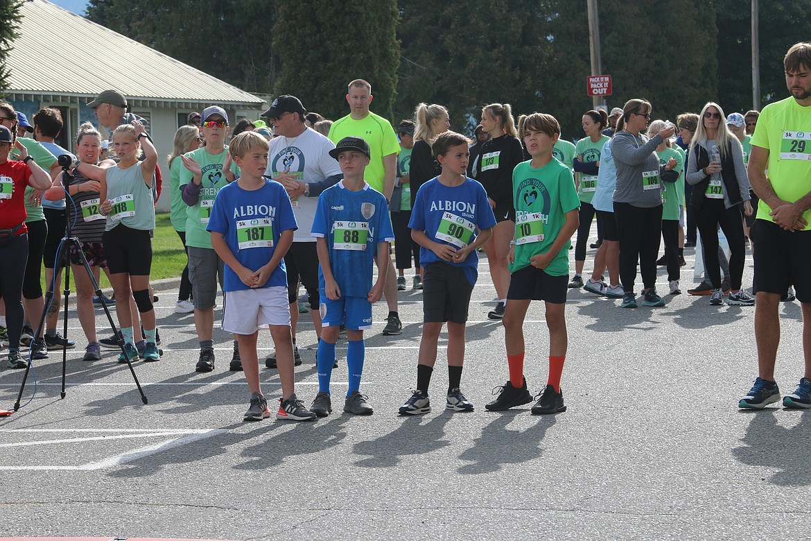 A quartet of runners wait for the start of the 2023 Find Your Strength Family Fun Run's 5K race. This year's event is taking part on Saturday, Sept. 14.