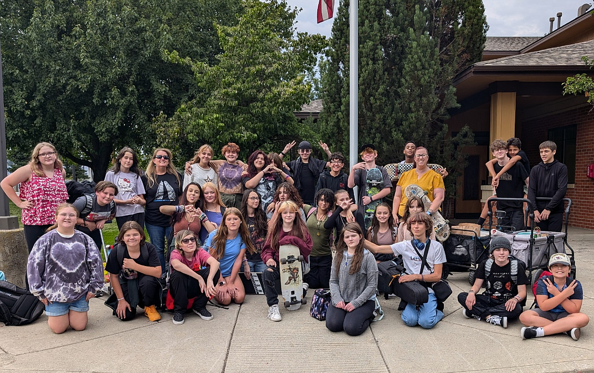 Lakes Middle Schoolers pause for a photo Wednesday at Coeur d'Alene Fire Station No. 3. The students brought gifts and cards to honor local first responders in commemoration of the events of 9/11.