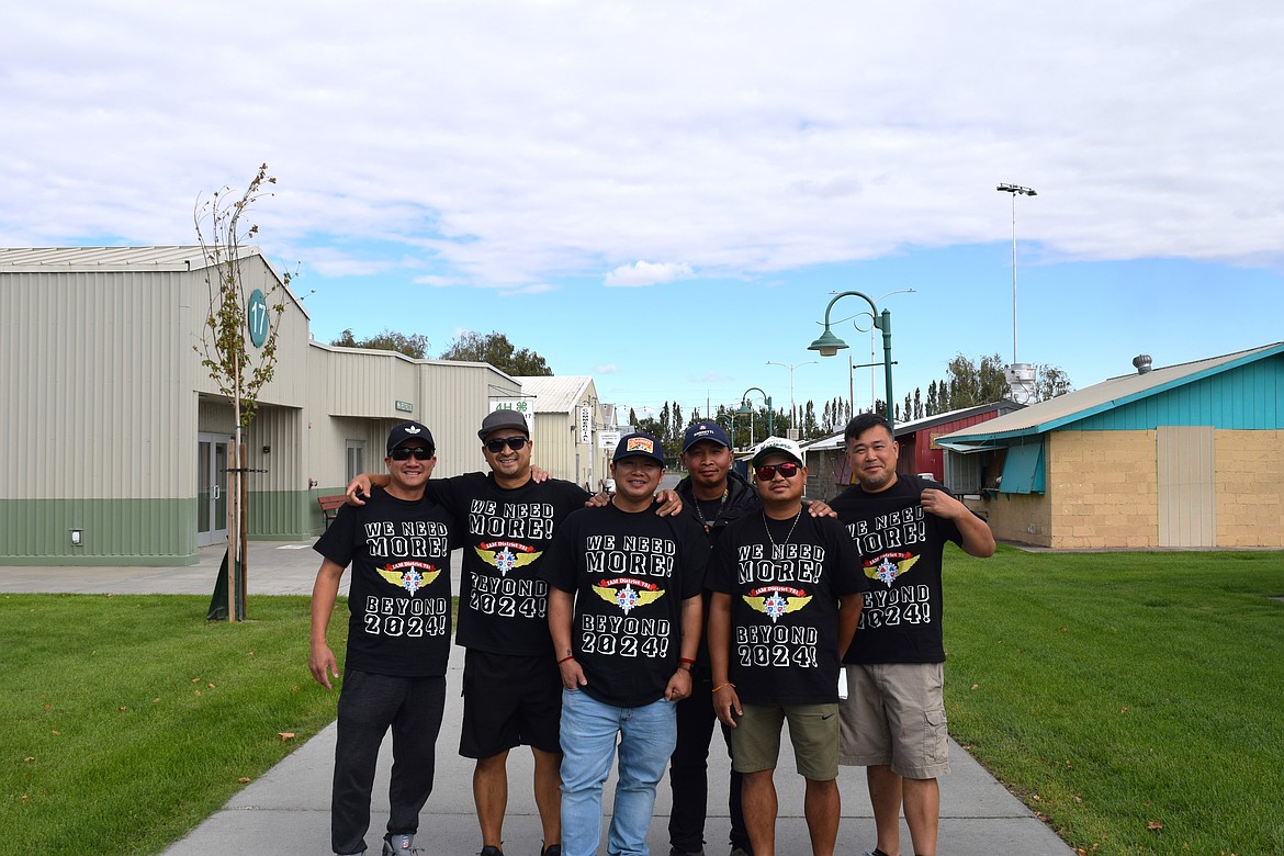 Workers at Boeing made shirts in support of a strike and wore them to the vote Thursday at the Grant County Fairgrounds. From left to right are Bao Nguyen, Marvin Soysouvanh, Vannak Meas, Bal Tim, Thoeun Prom and Veasna Pung. No one in the group wanted to comment on the matter to the press.