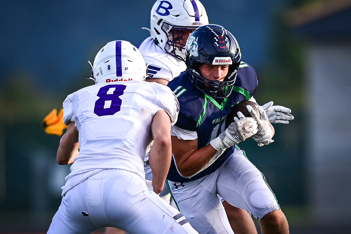 Glacier running back Asher Knopik (11) picks up yardage on a run in the second quarter against Butte at Legends Stadium on Friday, Sept. 13. (Casey Kreider/Daily Inter Lake)