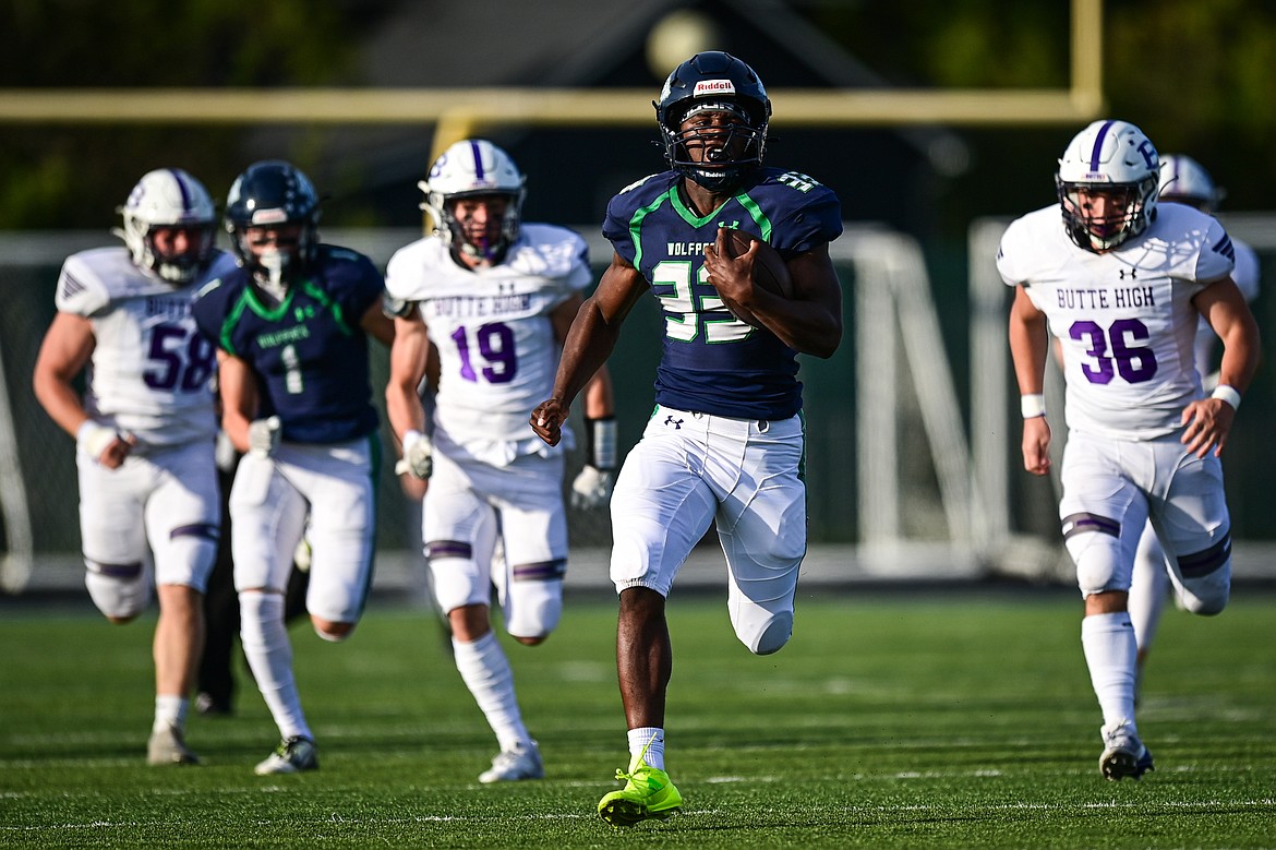 Glacier running back Kobe Dorcheus (33) scores a touchdown on a 65-yard run in the first quarter against Butte at Legends Stadium on Friday, Sept. 13. (Casey Kreider/Daily Inter Lake)