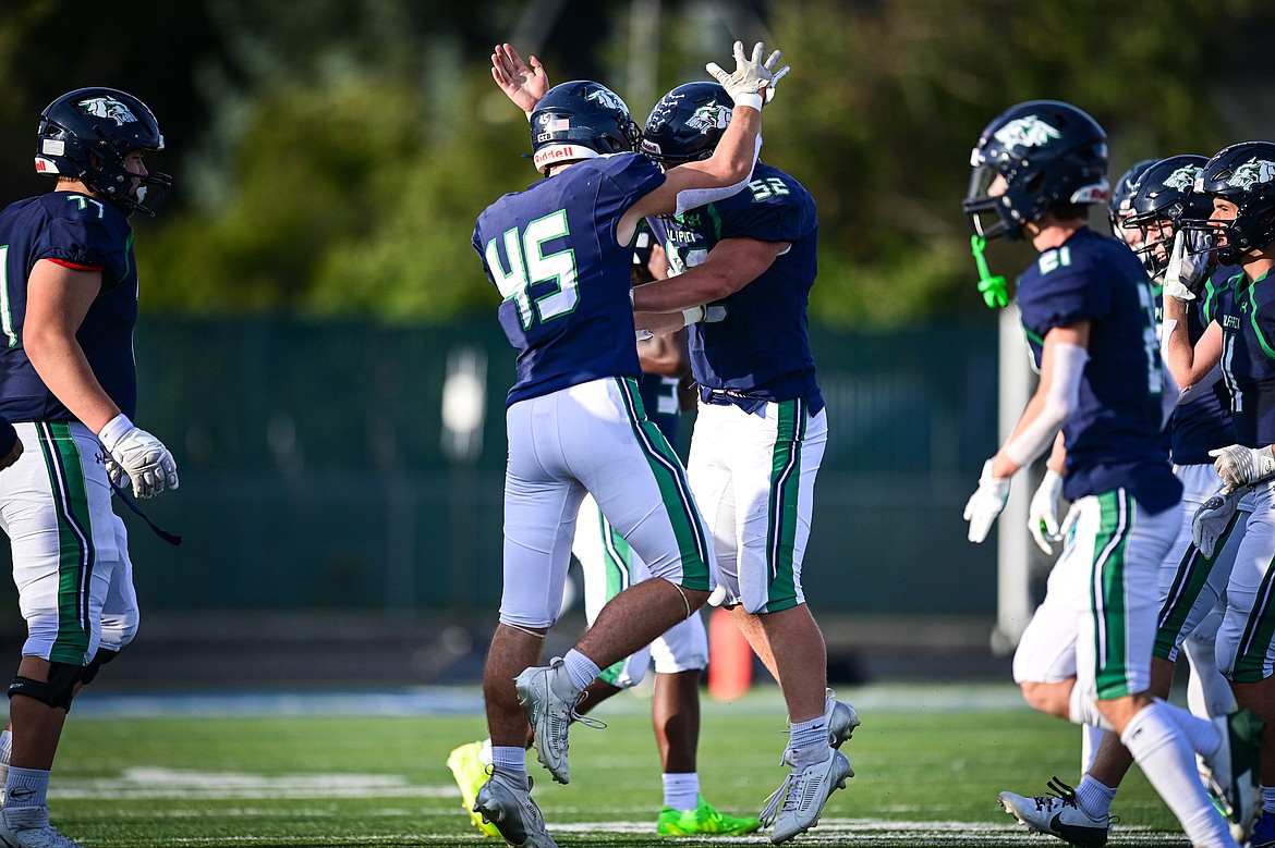 Glacier defensive lineman Wayne Cox (52) celebrates with linebacker Matthew Junk (45) after an interception in the first quarter against Butte at Legends Stadium on Friday, Sept. 13. (Casey Kreider/Daily Inter Lake)