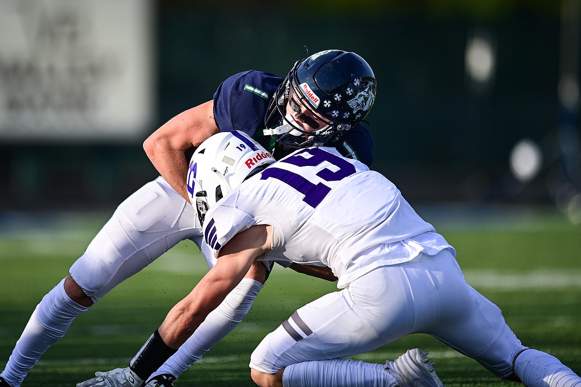 Glacier wide receiver Bridger Smith (1) is brought down by Butte defensive back Torre Tempel (19) in the first quarter at Legends Stadium on Friday, Sept. 13. (Casey Kreider/Daily Inter Lake)