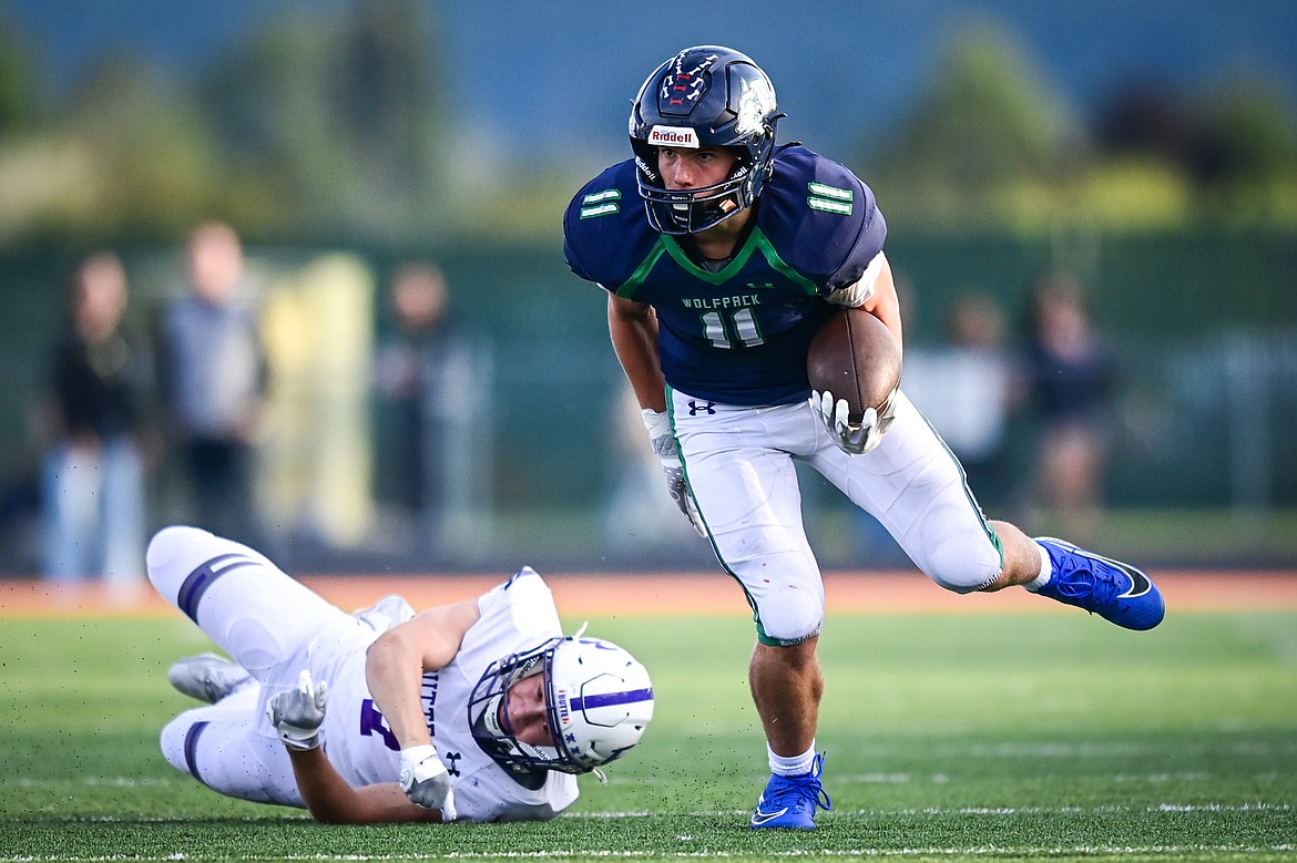 Glacier running back Asher Knopik (11) picks up yardage on a run in the second quarter against Butte at Legends Stadium on Friday, Sept. 13. (Casey Kreider/Daily Inter Lake)