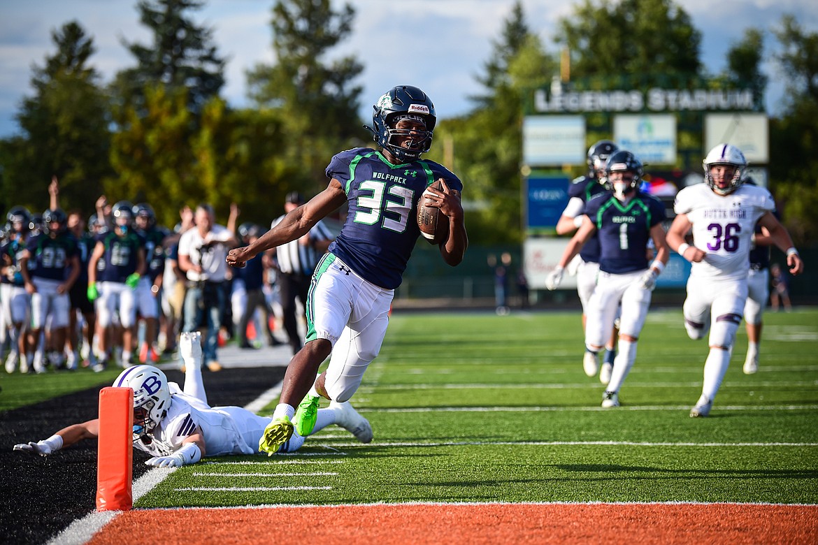 Glacier running back Kobe Dorcheus (33) scores a touchdown on a 65-yard run in the first quarter against Butte at Legends Stadium on Friday, Sept. 13. (Casey Kreider/Daily Inter Lake)