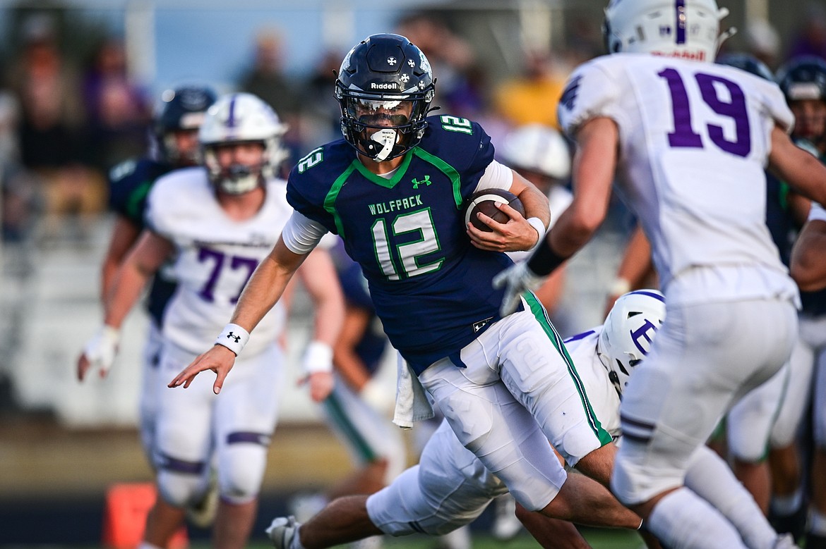 Glacier quarterback Jackson Presley (12) runs for an 11-yard touchdown in the second quarter against Butte at Legends Stadium on Friday, Sept. 13. (Casey Kreider/Daily Inter Lake)