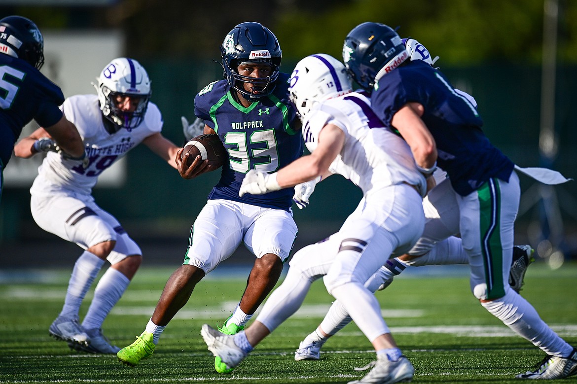 Glacier running back Kobe Dorcheus (33) picks up yardage on a run in the first quarter against Butte at Legends Stadium on Friday, Sept. 13. (Casey Kreider/Daily Inter Lake)